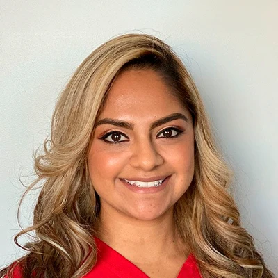 Professional Headshot Of A Person With Long Wavy Hair